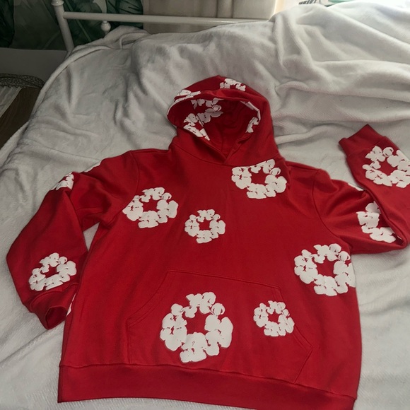 Denim Tears Red Hoodie with White Floral Design